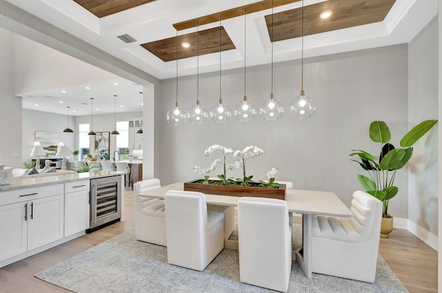 dining area with wine cooler, beam ceiling, light wood-style floors, recessed lighting, and coffered ceiling