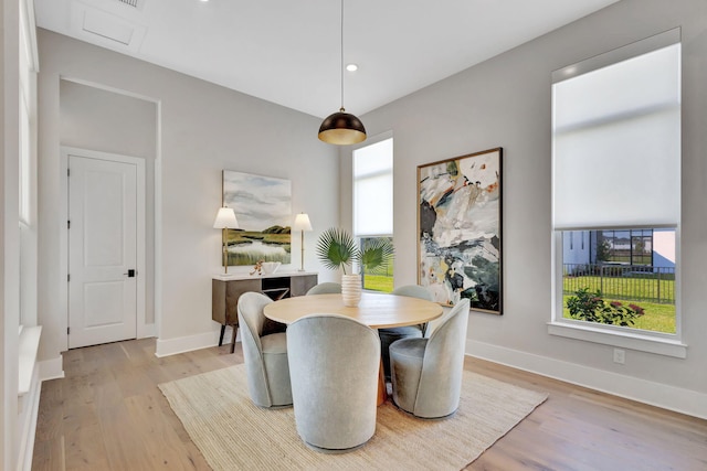 dining space featuring recessed lighting, baseboards, and wood finished floors