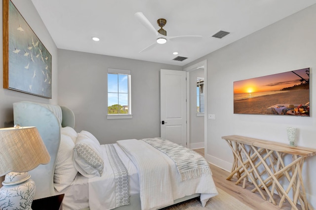 bedroom with visible vents, recessed lighting, ceiling fan, and wood finished floors