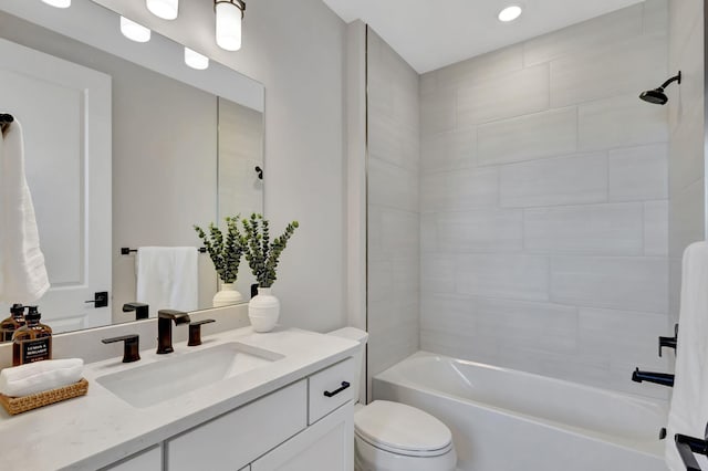 full bathroom with vanity, recessed lighting, tub / shower combination, and toilet