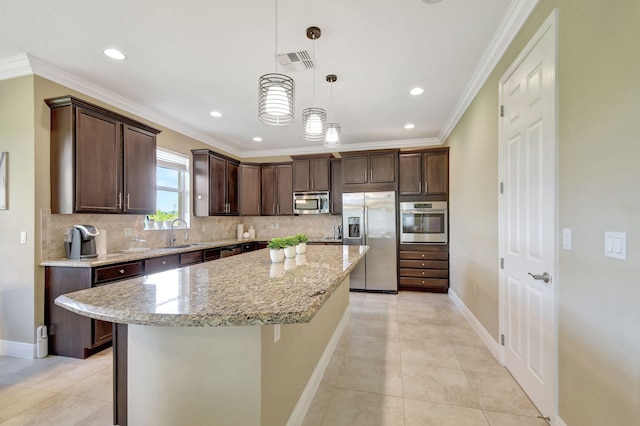 kitchen featuring dark brown cabinetry, appliances with stainless steel finishes, a sink, baseboards, and visible vents