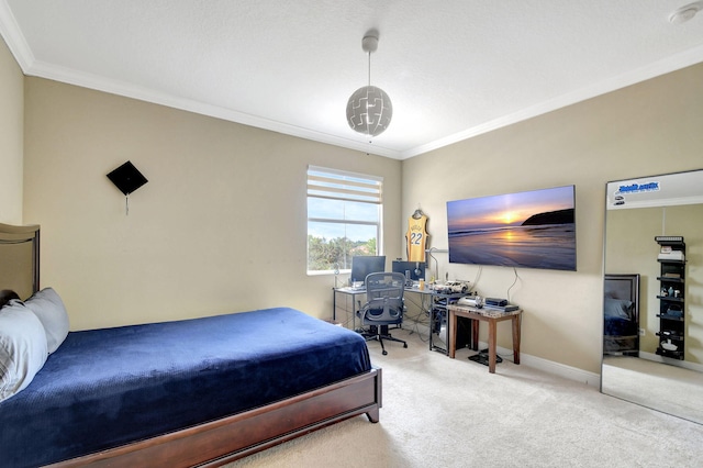 bedroom featuring carpet flooring, crown molding, and baseboards