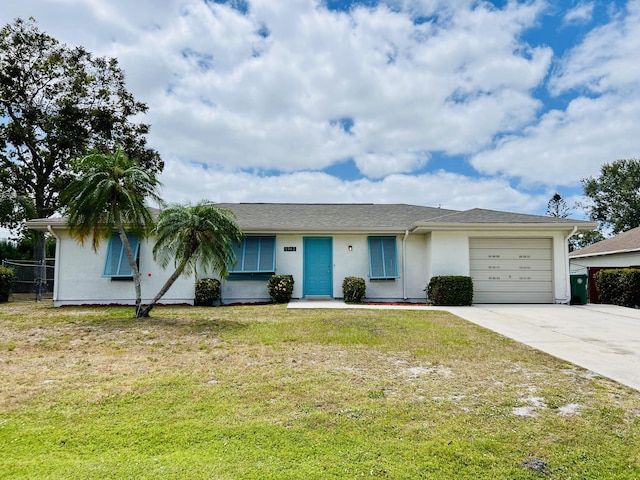 1942 SE Carvalho St, Port Saint Lucie, FL 34983 - ranch-style home featuring a garage, fence, a front lawn, concrete driveway, and stucco siding