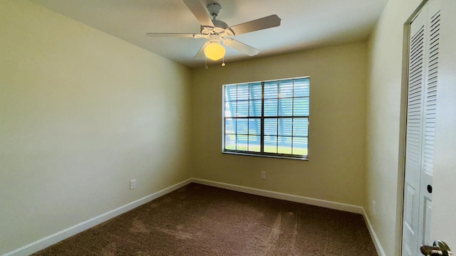 1942 SE Carvalho St, Port Saint Lucie, FL 34983 - spare room with baseboards, ceiling fan, and dark colored carpet