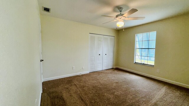 1942 SE Carvalho St, Port Saint Lucie, FL 34983 - unfurnished bedroom with baseboards, carpet, a closet, and visible vents