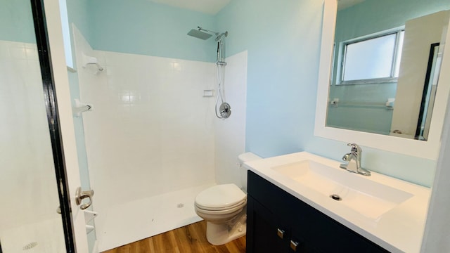 1942 SE Carvalho St, Port Saint Lucie, FL 34983 - bathroom with wood finished floors, toilet, and a shower stall