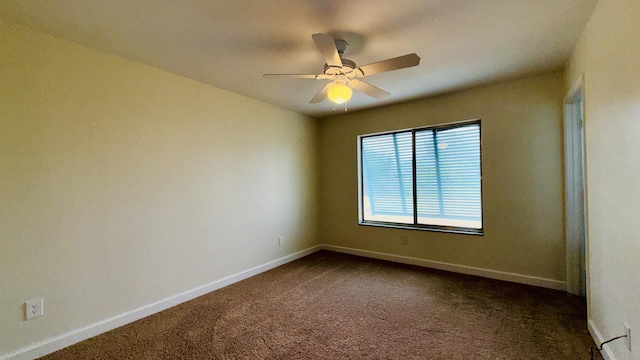 1942 SE Carvalho St, Port Saint Lucie, FL 34983 - unfurnished room with dark carpet, a ceiling fan, and baseboards