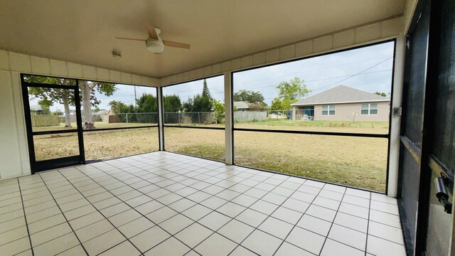 1942 SE Carvalho St, Port Saint Lucie, FL 34983 - unfurnished sunroom with a healthy amount of sunlight and a ceiling fan