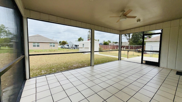 1942 SE Carvalho St, Port Saint Lucie, FL 34983 - unfurnished sunroom with a ceiling fan and a residential view