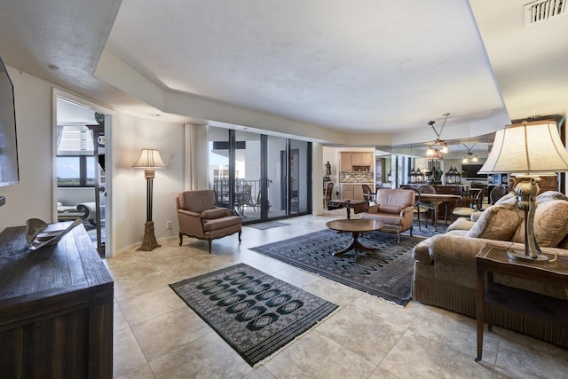 3800 Washington Rd Unit 1002, West Palm Beach, FL 33405 - living area with light tile patterned flooring and baseboards