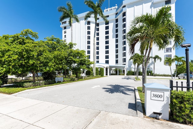 3800 Washington Rd Unit 1002, West Palm Beach, FL 33405 - view of apartment building / complex featuring a carport and driveway