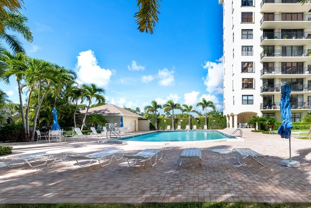 3800 Washington Rd Unit 1002, West Palm Beach, FL 33405 - community pool with a patio