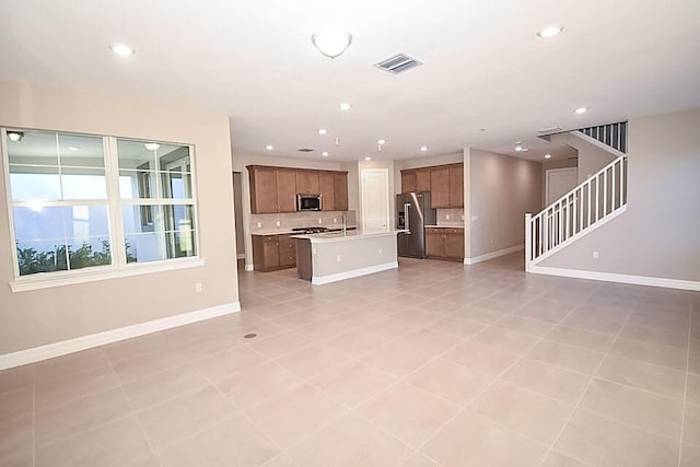 12546 Triumph Ln, Palm Beach Gardens, FL 33412 - unfurnished living room with baseboards, recessed lighting, stairs, and visible vents