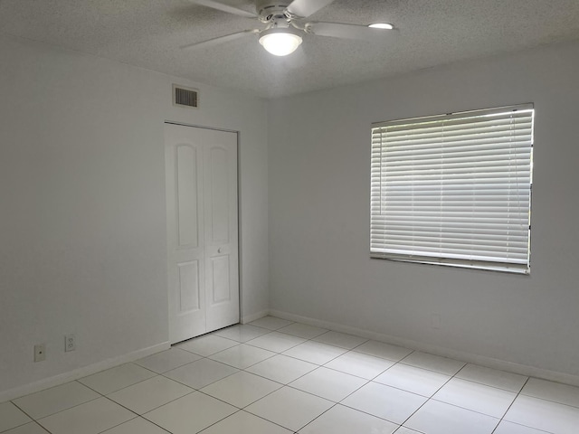 21365 Cypress Hammock Dr Unit 20G, Boca Raton, FL 33428 - unfurnished room featuring ceiling fan, a textured ceiling, and light tile patterned floors