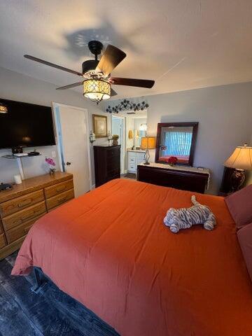 bedroom with a ceiling fan and wood finished floors