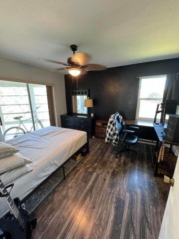 bedroom with ceiling fan and wood finished floors