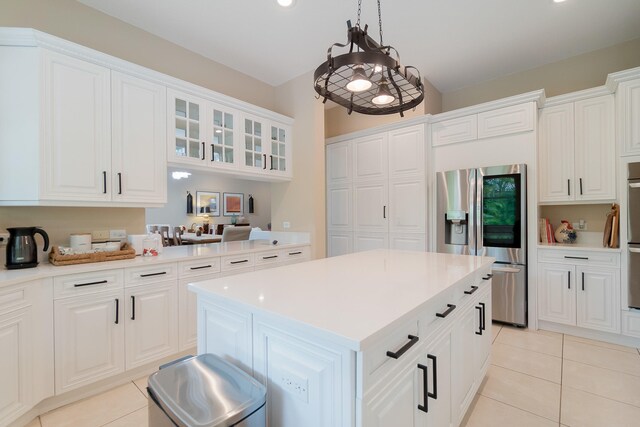 4510 Island Reef Dr, Wellington, FL 33449 - kitchen featuring light countertops, stainless steel fridge with ice dispenser, and light tile patterned flooring