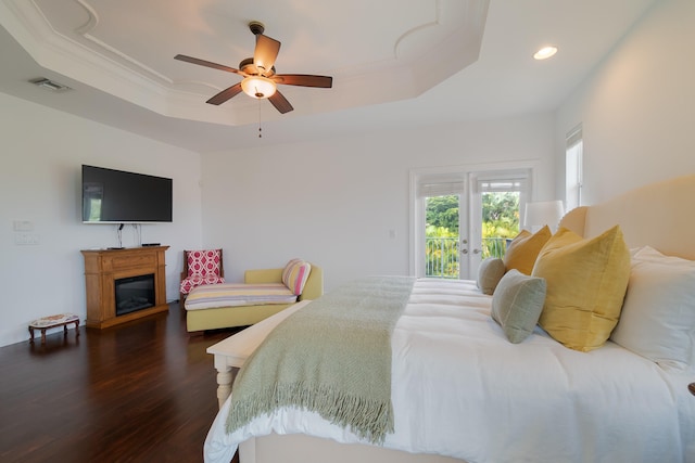 4510 Island Reef Dr, Wellington, FL 33449 - bedroom featuring recessed lighting, a raised ceiling, access to outside, and dark wood-style flooring