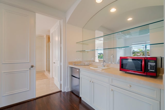4510 Island Reef Dr, Wellington, FL 33449 - bar featuring freestanding refrigerator, dark wood finished floors, recessed lighting, a sink, and wet bar