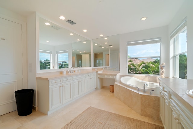 4510 Island Reef Dr, Wellington, FL 33449 - full bathroom featuring a sink, two vanities, a garden tub, and a wealth of natural light