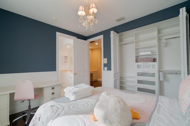4510 Island Reef Dr, Wellington, FL 33449 - bedroom featuring visible vents, a sink, a closet, a chandelier, and ensuite bath