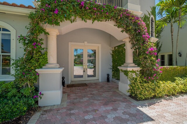 4510 Island Reef Dr, Wellington, FL 33449 - view of exterior entry with french doors and stucco siding