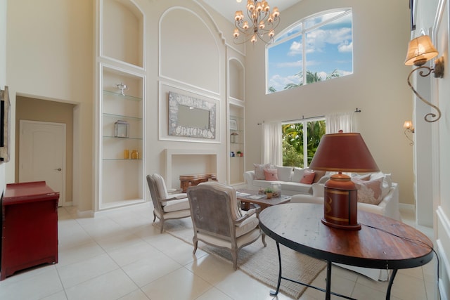 4510 Island Reef Dr, Wellington, FL 33449 - interior space with light tile patterned floors, built in features, a high ceiling, and a notable chandelier