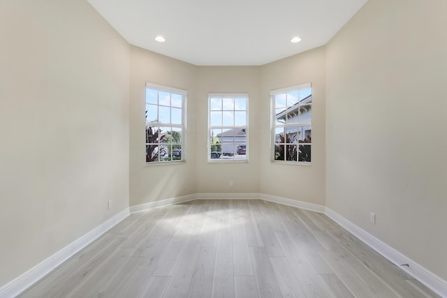 9252 SW Miracoli Way, Port Saint Lucie, FL 34987 - unfurnished room featuring baseboards, light wood finished floors, and recessed lighting