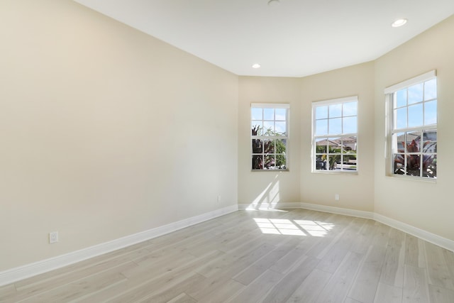 9252 SW Miracoli Way, Port Saint Lucie, FL 34987 - unfurnished room with light wood finished floors, a wealth of natural light, baseboards, and recessed lighting
