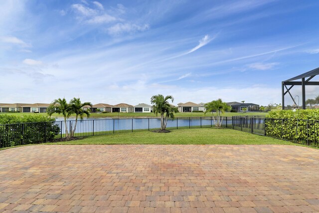 9252 SW Miracoli Way, Port Saint Lucie, FL 34987 - view of patio / terrace with a water view, a residential view, and a fenced backyard