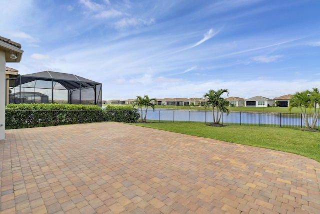 9252 SW Miracoli Way, Port Saint Lucie, FL 34987 - view of patio with a fenced backyard, a lanai, a water view, and a residential view