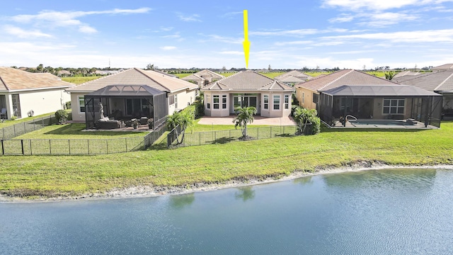 9252 SW Miracoli Way, Port Saint Lucie, FL 34987 - rear view of property with a yard, a patio area, a tile roof, and a fenced backyard
