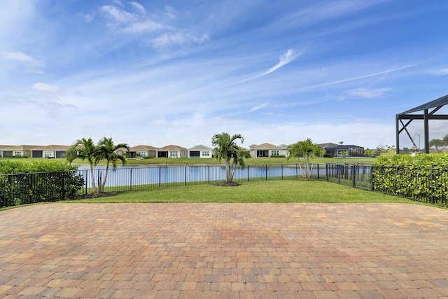 9252 SW Miracoli Way, Port Saint Lucie, FL 34987 - view of patio / terrace with a water view, a residential view, and a fenced backyard