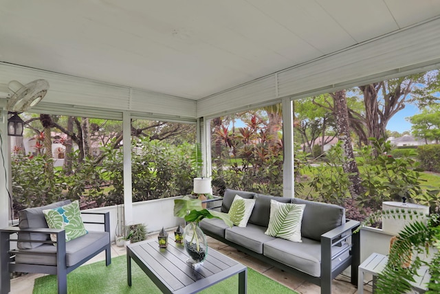 sunroom / solarium featuring an outdoor hangout area