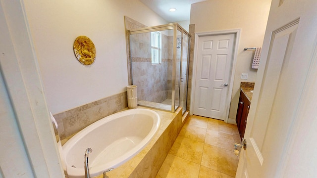 2323 NW Padova St, Port Saint Lucie, FL 34986 - full bathroom with tile patterned flooring, vanity, a bath, and a shower stall