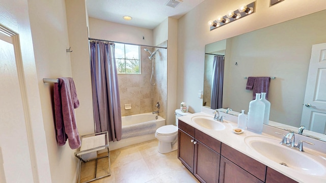 2323 NW Padova St, Port Saint Lucie, FL 34986 - bathroom with double vanity, toilet, visible vents, and a sink