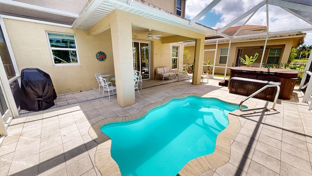 2323 NW Padova St, Port Saint Lucie, FL 34986 - outdoor pool with a hot tub, a patio, ceiling fan, and a lanai