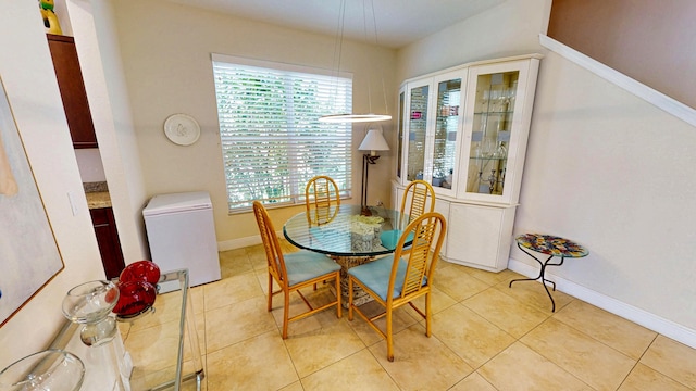 2323 NW Padova St, Port Saint Lucie, FL 34986 - dining space with baseboards, light tile patterned floors, and a wealth of natural light