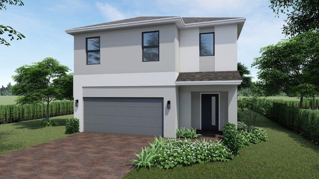 contemporary house with decorative driveway, a garage, a front lawn, and stucco siding
