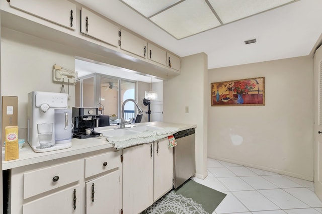 950 Egret Cir Unit 5409, Delray Beach, FL 33444 - kitchen with a sink, dishwasher, light countertops, light tile patterned floors, and visible vents