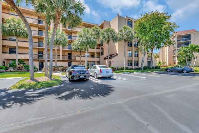 950 Egret Cir Unit 5409, Delray Beach, FL 33444 - view of building exterior featuring uncovered parking