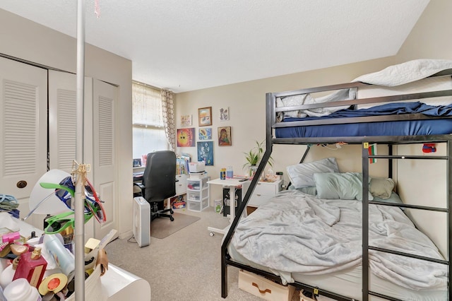 950 Egret Cir Unit 5409, Delray Beach, FL 33444 - bedroom with a textured ceiling and carpet
