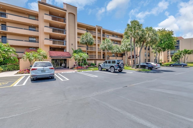 950 Egret Cir Unit 5409, Delray Beach, FL 33444 - view of building exterior featuring uncovered parking