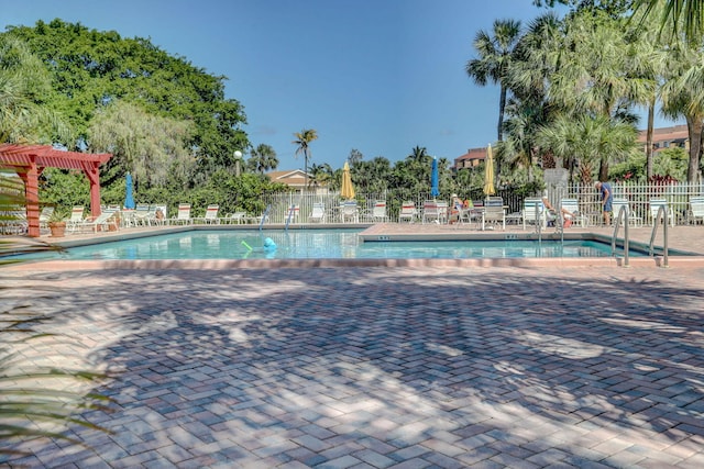 950 Egret Cir Unit 5409, Delray Beach, FL 33444 - pool with a patio area, fence, and a pergola
