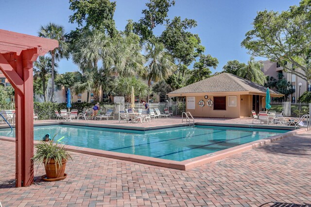950 Egret Cir Unit 5409, Delray Beach, FL 33444 - pool featuring fence, a pergola, and a patio area