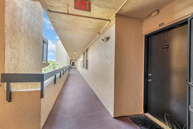 950 Egret Cir Unit 5409, Delray Beach, FL 33444 - doorway to property with stucco siding and a balcony