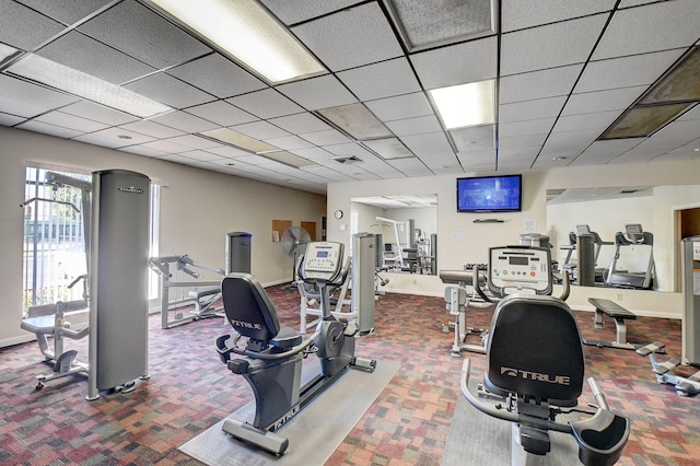 950 Egret Cir Unit 5409, Delray Beach, FL 33444 - workout area featuring baseboards, carpet, and a drop ceiling