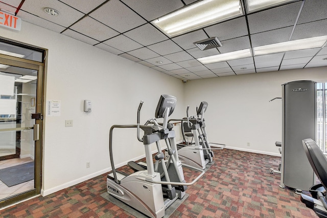 950 Egret Cir Unit 5409, Delray Beach, FL 33444 - workout area featuring baseboards, visible vents, a paneled ceiling, and carpet