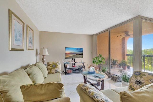 950 Egret Cir Unit 5409, Delray Beach, FL 33444 - living area with a wall of windows, a ceiling fan, light tile patterned flooring, and a textured ceiling