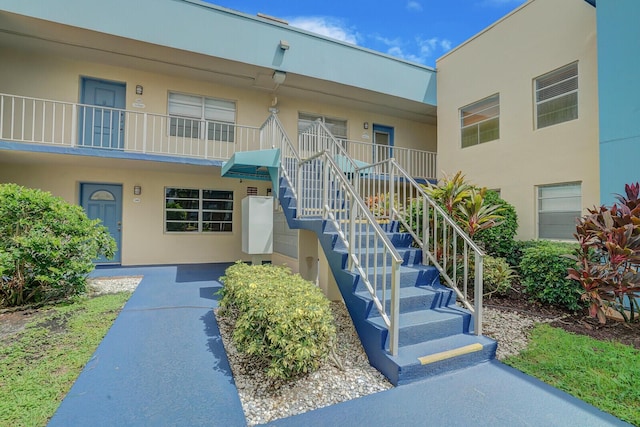 view of property with stairway